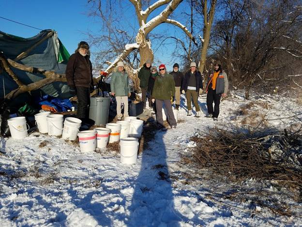 A group of people standing in the snow